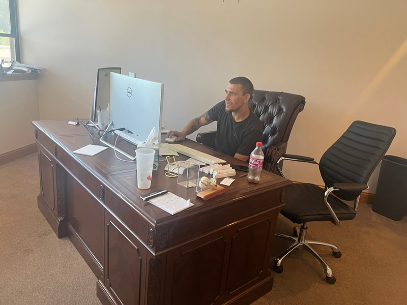Ryan working at his desk in Illinois