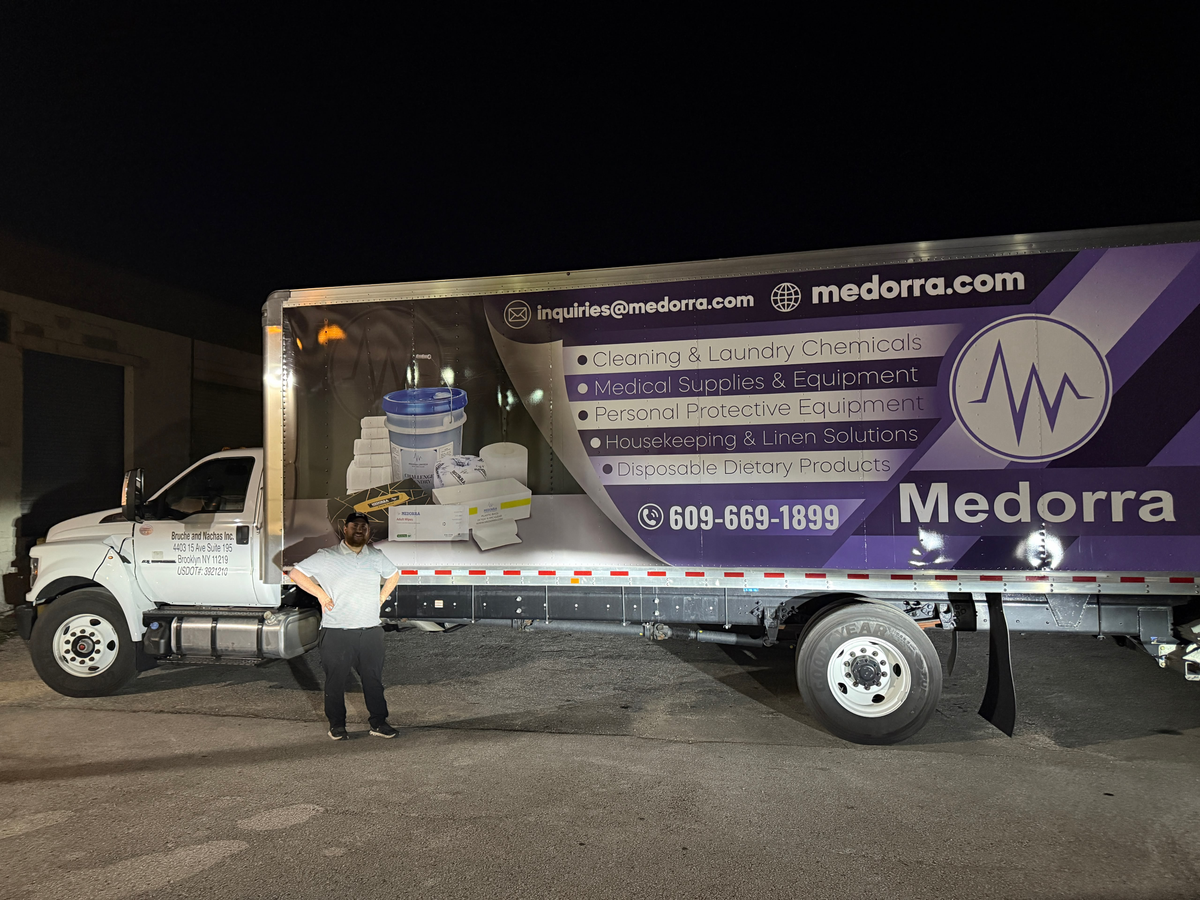 One of Medorra’s twelve delivery trucks, with a team member